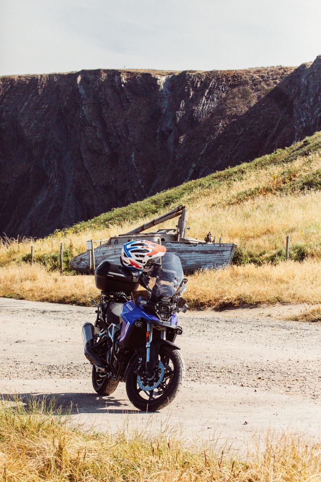 Motorcycle parked on a coastal road at Hartland Quay,