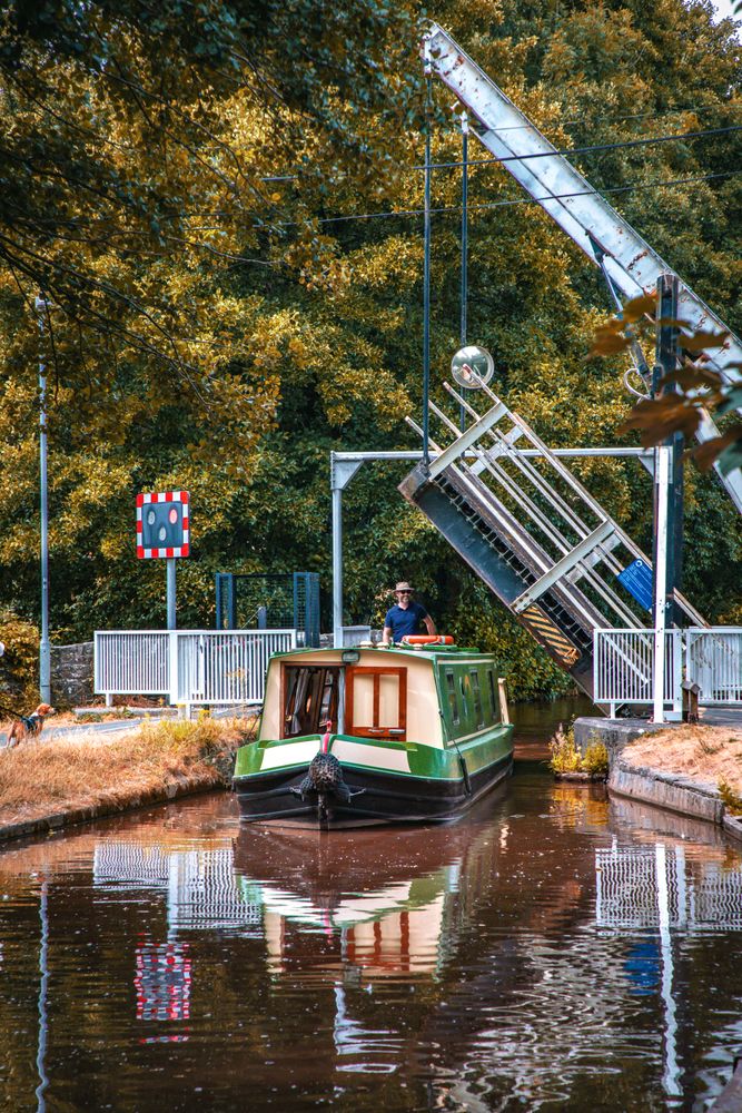 canal boat navigating through a scenic canal near Talybont